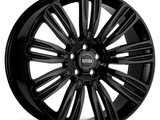 A glossy black car wheel with a multi-spoke design and 