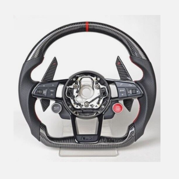 A carbon fiber steering wheel, featuring electronic controls and paddle shifters, rests on a stand. It includes buttons labeled "MODE," "RES," "SET," "VIEW," and a red "START ENGINE STOP" button.