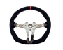 A steering wheel with a black, fabric-covered rim and a red stripe at the top, features a metallic core with attachment points, against a plain white background.