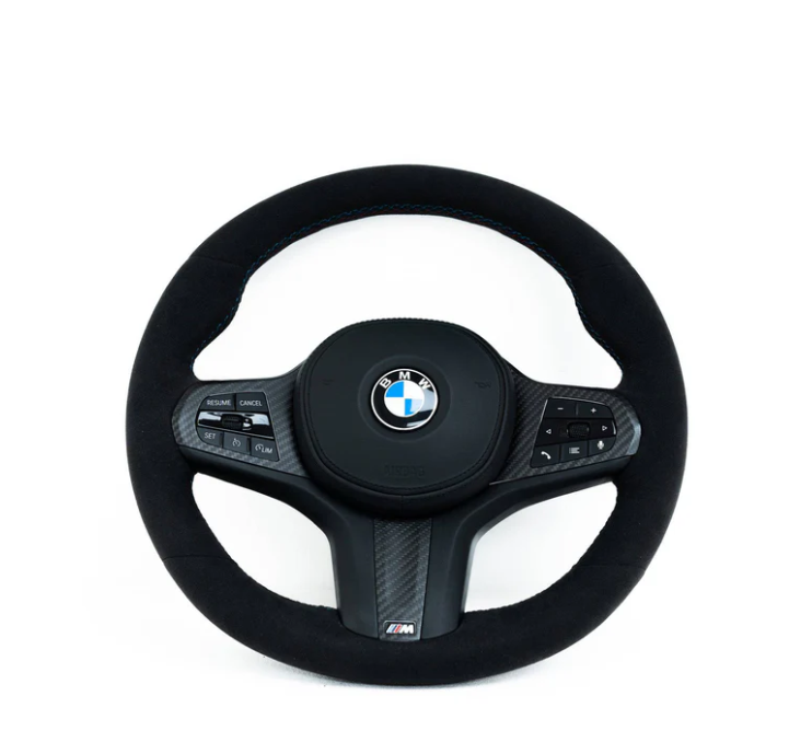 A round, black BMW steering wheel, featuring control buttons, is set against a plain white background. BMW logo in the center, "M" branding below.