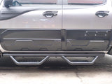 A rugged vehicle features side protective bars and reinforced step plates along two tightly sealed, dark-colored doors, parked on a concrete surface with large off-road tires partially visible.