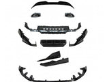 A collection of car body parts, including grills and bumper components, is arranged separately. The pieces are black and spread out against a plain white background, indicating disassembled condition.