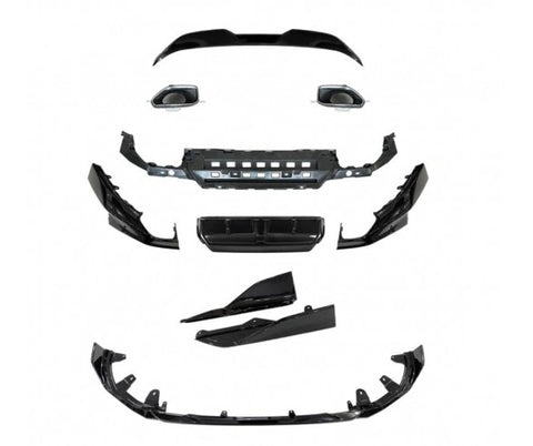 A collection of car body parts, including grills and bumper components, is arranged separately. The pieces are black and spread out against a plain white background, indicating disassembled condition.