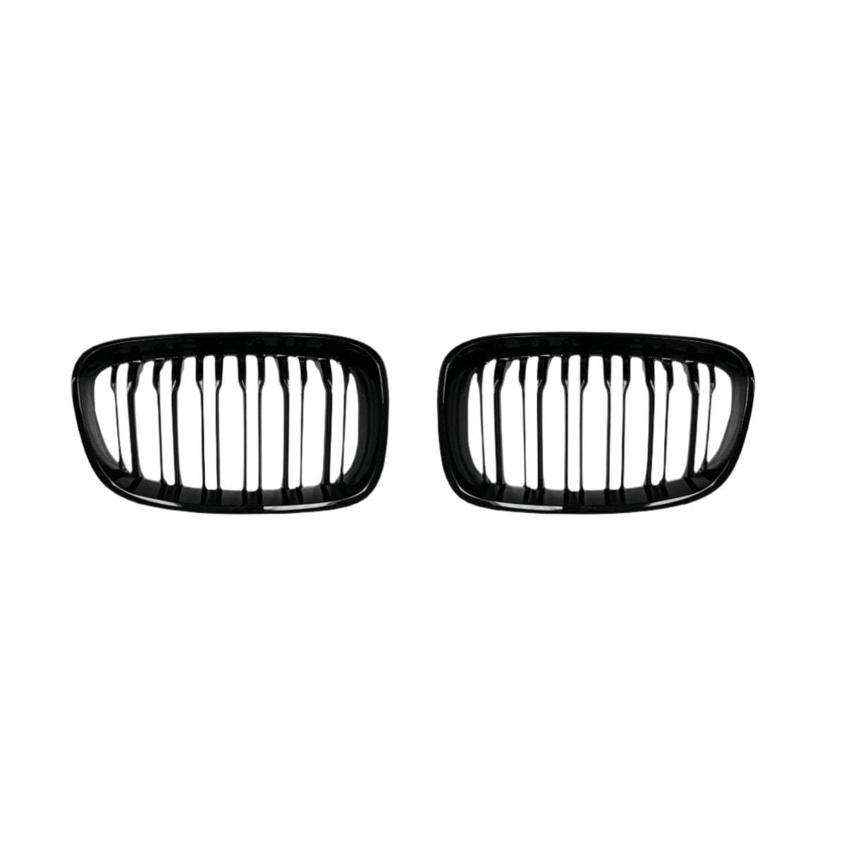 Two black, oval-shaped car grilles with vertical slats sit side by side against a plain white background, suggesting automotive components for vehicle front ends.