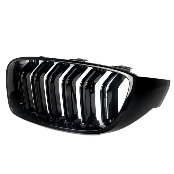 A glossy black car grille features vertical slats with a chrome finish, against a plain white background, designed for the front of a vehicle.