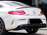A white Mercedes-Benz C 300 AMG parked on a cobblestone surface, displaying dual exhausts under its rear bumper, near modern building. Text: “C 300” and “AMG” badges.