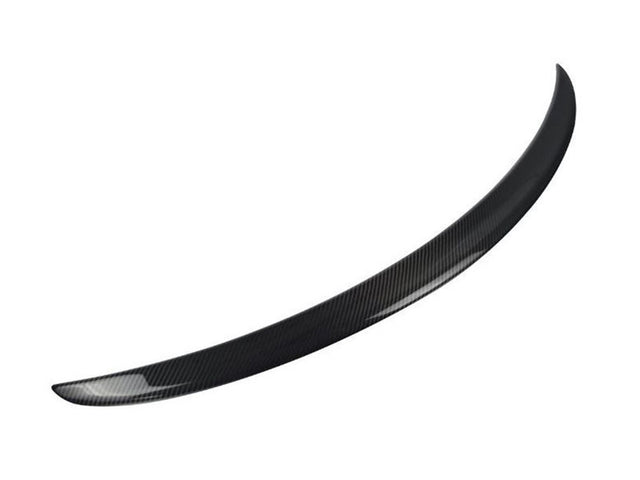 A curved, black carbon fiber car spoiler is displayed, isolated against a plain white background, emphasizing its smooth, aerodynamic design.