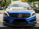 A blue Mercedes-Benz car is parked on a street, featuring a blacked-out grille and hood with vents. Surrounding it are trees and other parked vehicles in an outdoor setting.