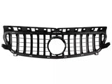 A black car grille with vertical and horizontal slats features a central circular space for an emblem. 