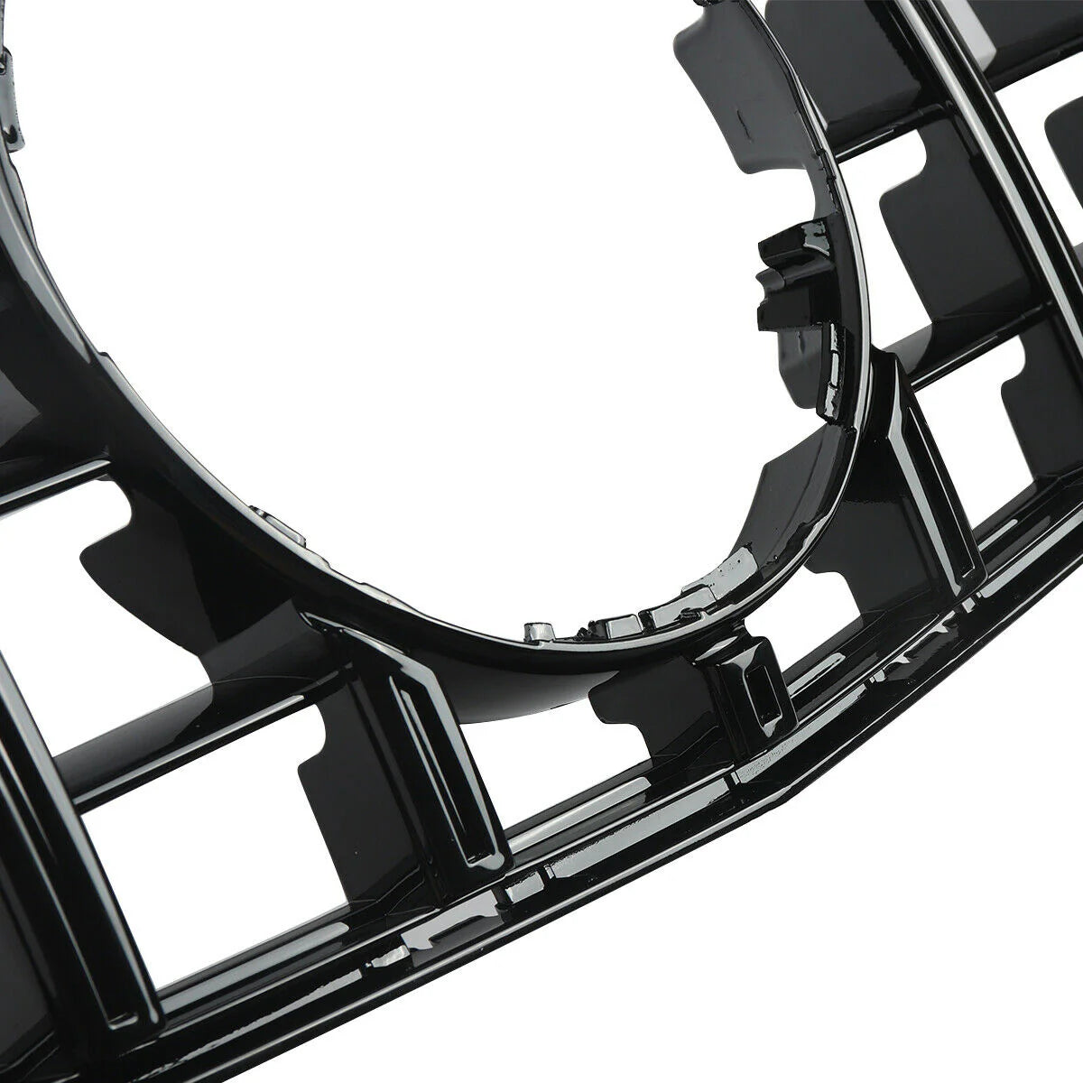 The image features a glossy black plastic car grille with a prominent circular opening, showcasing a grid pattern and intricate detailing, suggesting it is part of a vehicle's front design.