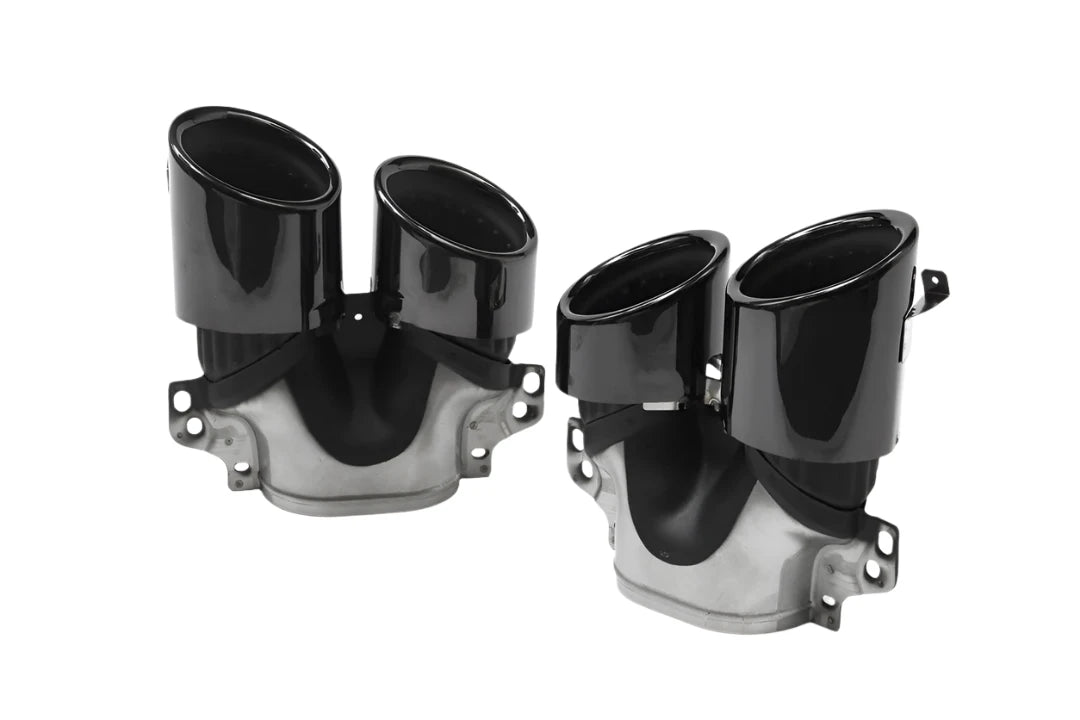 Two shiny black dual exhaust tips, mounted on metallic bases, are displayed on a plain white background. They have a sleek, curved design and multiple attachment points.