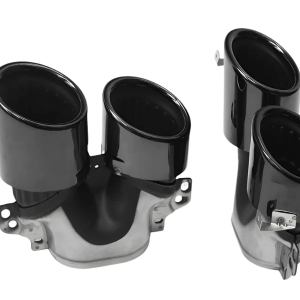 Black dual exhaust tips sit on a white background, featuring a glossy finish with mounting brackets attached, designed for vehicle exhaust systems.
