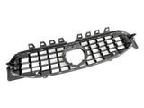 A black car grille features a grid pattern with a central circular opening, likely for an emblem. It's positioned against a plain, white background.