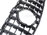 A black plastic grille featuring a series of rectangular openings surrounds a central circular cutout, set against a plain white background.