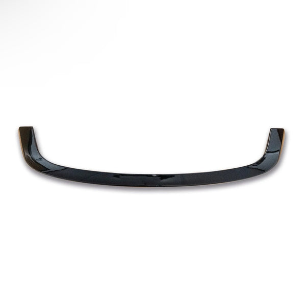 A glossy, black, curved car spoiler with slightly raised ends rests on a plain white background, highlighting its sleek design.