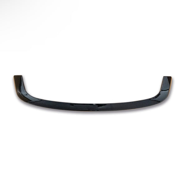 A glossy, black, curved car spoiler with slightly raised ends rests on a plain white background, highlighting its sleek design.