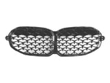 The object is a shiny black car grille with a honeycomb pattern, designed for front attachment, with two connected oval sections, isolated on a plain white background.