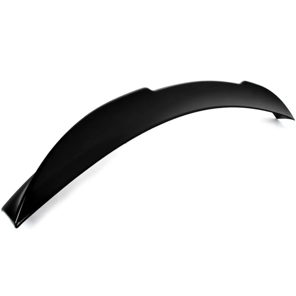 A black, curved car spoiler rests on a plain white background, displaying its smooth, aerodynamic design intended for vehicle performance enhancement. No text present.