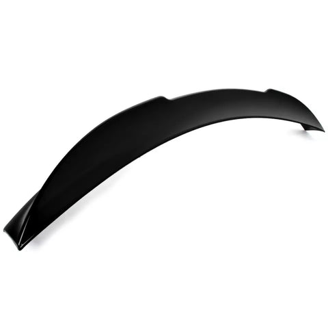 A black, curved car spoiler rests on a plain white background, displaying its smooth, aerodynamic design intended for vehicle performance enhancement. No text present.