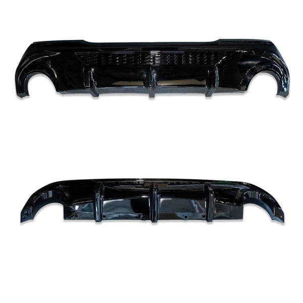 A pair of glossy black car diffusers, each featuring curved edges and vertical fins, positioned on a plain white background.