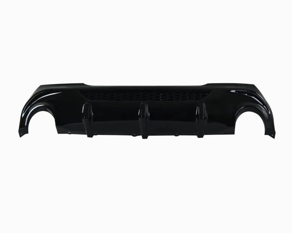 A glossy black car rear bumper diffuser lies horizontally. It features three vertical fins and a mesh section, isolated against a plain white background.