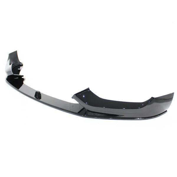 A glossy black car front bumper lip sits on a plain white background, featuring a sleek, aerodynamic design with curved edges and mounting points.