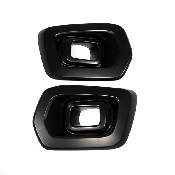 Two black, rectangular exhaust tip covers with beveled edges, placed side by side on a white background, showing their hollow interior.