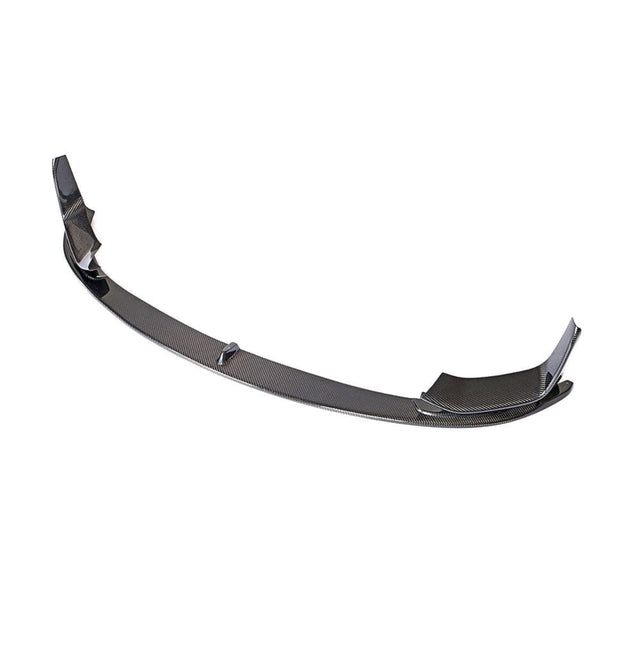 A carbon fiber car front lip spoiler is shown, arched with winged ends, designed to enhance aerodynamics. It's isolated on a plain white background.