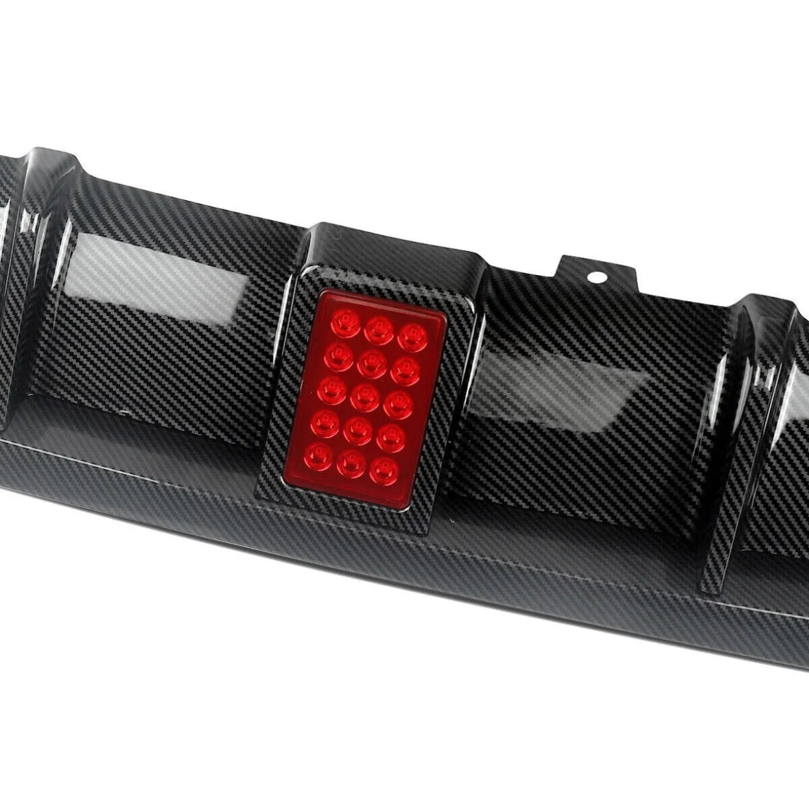 Carbon fiber car diffuser with a rectangular red LED light, designed in a grid pattern. Positioned against a plain white background, showcasing the sleek, textured surface and modern design.