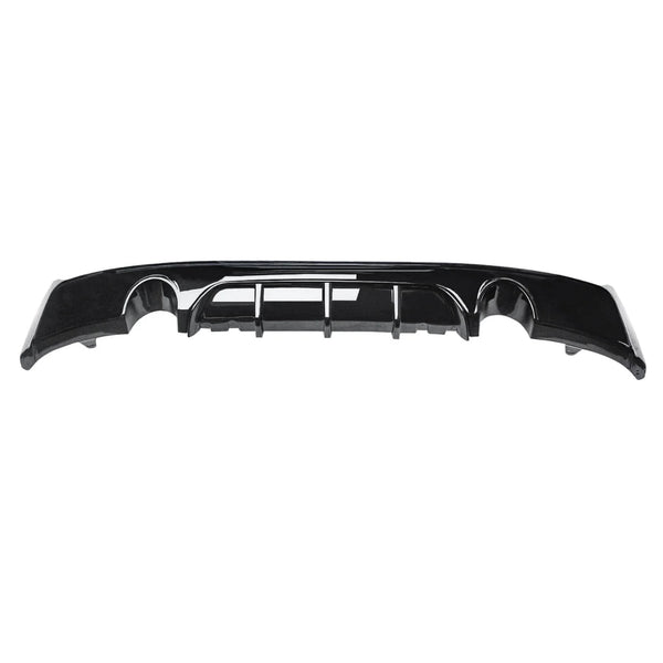 A black car bumper with built-in diffuser sits against a white background, featuring aerodynamic grooves and a shiny finish.