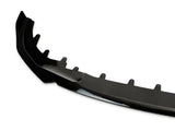 A black car bumper cover with mounting tabs is positioned against a plain white background, showcasing its contour and attachment points.