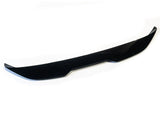 A sleek, black car front lip spoiler rests on a white background, featuring sharp edges and a subtle curvature designed to improve aerodynamics.