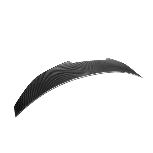 A sleek, curved black car spoiler made of carbon fiber sits isolated against a plain white background, emphasizing its aerodynamic design.