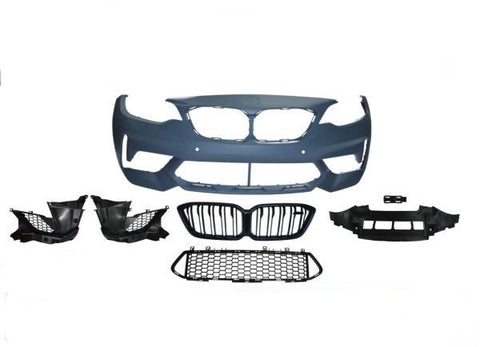 Car bumper kit displayed with grille, fog light holders, and mesh grille sections. Components are laid out symmetrically against a plain white background, showcasing automotive parts assembly.