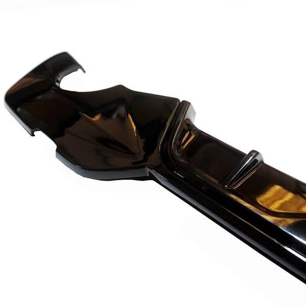 A glossy black plastic cover, featuring a curved design with ridges, is displayed against a white background. It appears to be a component possibly for protective or decorative use.
