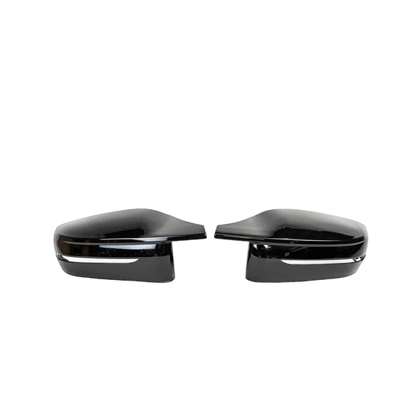 Two sleek, black side mirror covers are aligned symmetrically, facing inward, against a plain white background.