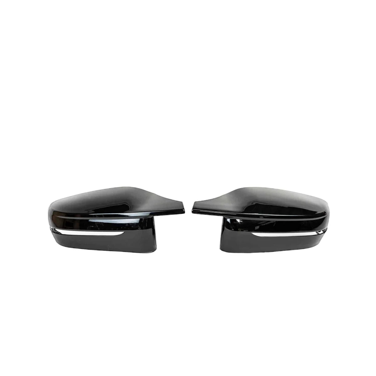 Two sleek, black side mirror covers are aligned symmetrically, facing inward, against a plain white background.