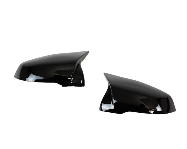 Two black side mirror covers are shown, facing each other, with a glossy finish, placed against a plain white background.