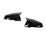 Two glossy black car side mirror covers, angled towards each other, are isolated on a white background. They are designed to fit over existing mirrors, offering a sleek, aerodynamic appearance.