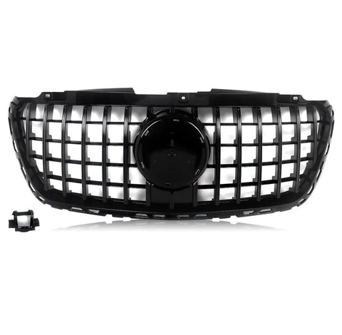 A black car grille features a grid design with a central circular emblem area, set against a white background. A detached rectangular component is located in the lower left corner.