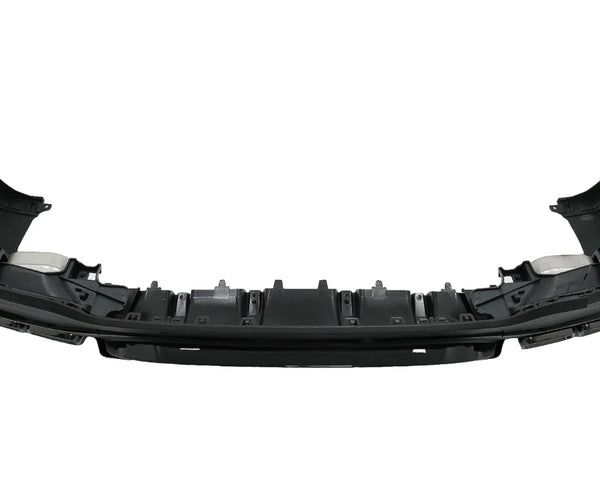 A black plastic car bumper, featuring mounting brackets and slots, is positioned in an isolated, white background setting.