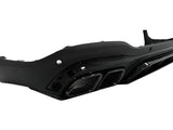 A black car bumper features dual exhaust cutouts and aerodynamic detailing, designed for rear attachment, against a plain, white background.