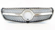 A shiny car grille features a prominent circular center, intricate mesh pattern, and chrome accents, positioned against a plain white background.