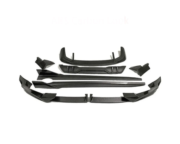 Car body kit parts arranged on a white background, featuring multiple angular black pieces designed for aerodynamic enhancement. Text reads "ABS Carbon Look."