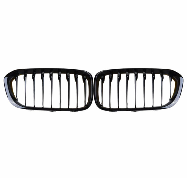 A pair of black, horizontally aligned kidney-shaped car grilles with vertical slats, set against a plain white background.