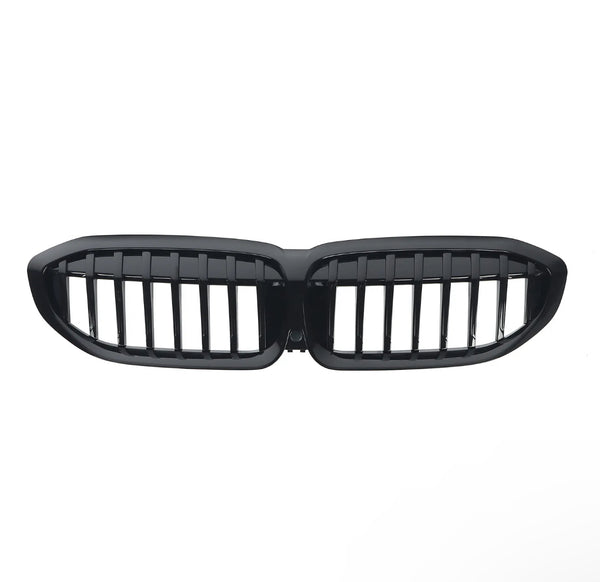 A glossy black car grille with vertical slats, shaped in two connected oval sections, is isolated on a white background.