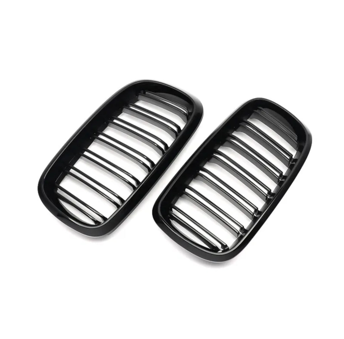 Two black automotive grille inserts, featuring horizontal bars, are placed against a plain white background, likely intended for a car's front end.