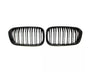 Two black car grilles with vertical slats are positioned side by side on a white background, suggesting they are replacement parts for specific vehicle models.
