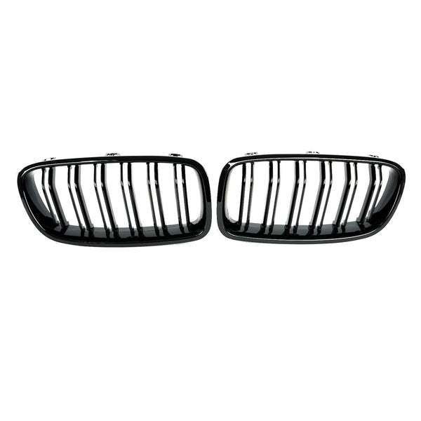 Two black, oval car grille inserts with vertical slats are positioned side by side against a plain white background.