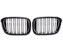Two black car grilles with vertical slats, aligned side by side against a white background, commonly used as front-end design elements for vehicle air intake and styling.